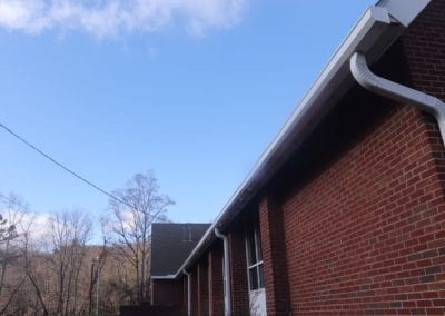 Church roof and white gutters